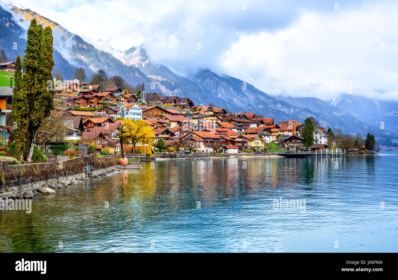 Old town of Oberried, Brienz, Interlaken and misty Alps mountains reflecting in lake, Switzerland Stock Photo