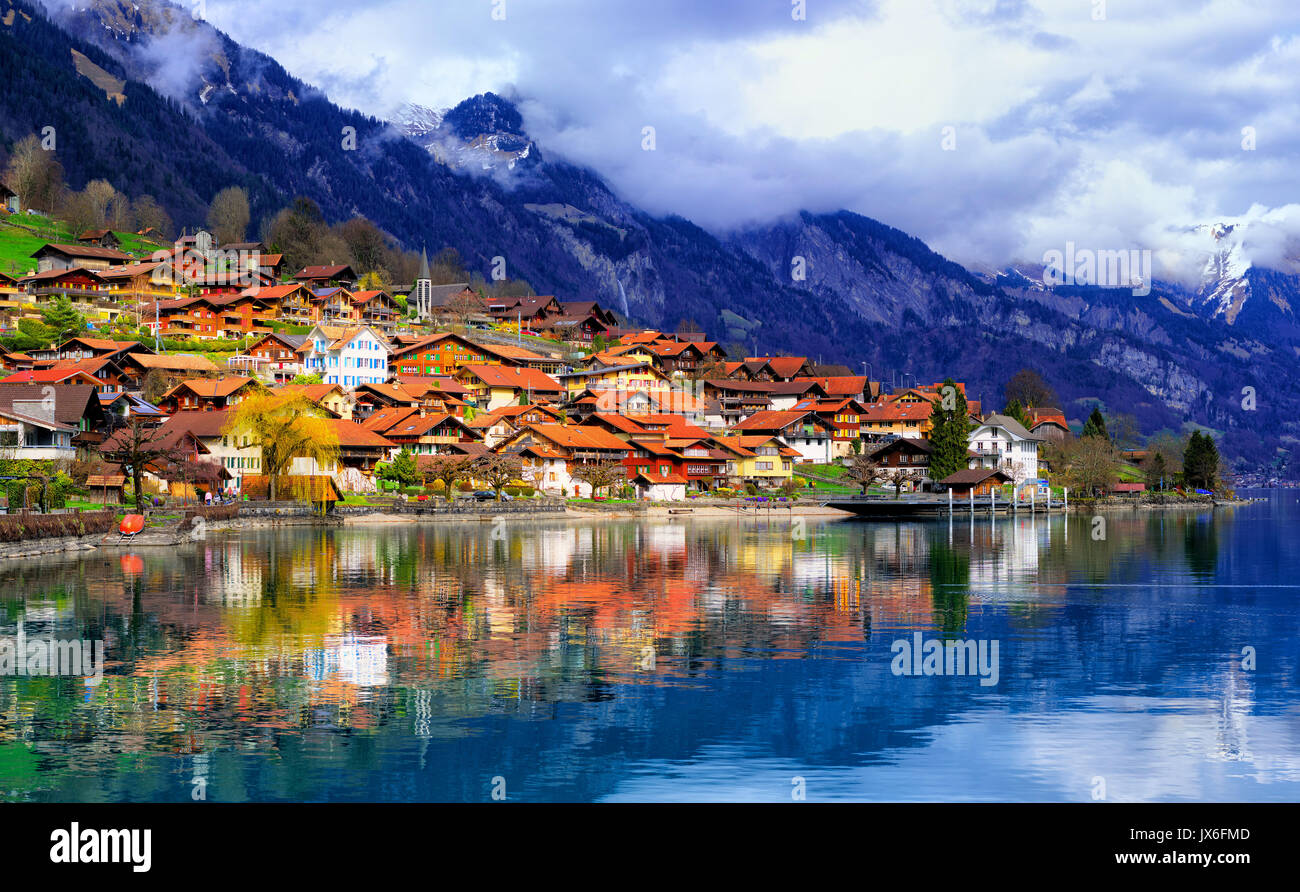 Old town of Oberried, Brienz, Interlaken and misty Alps mountains reflecting in lake, Switzerland Stock Photo