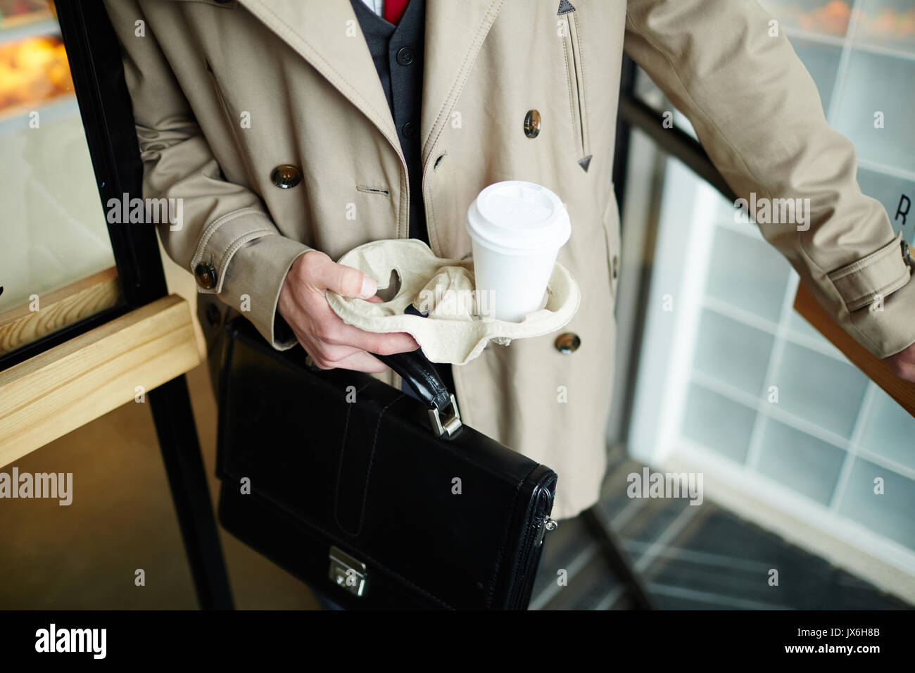 Man leaving cafe Stock Photo