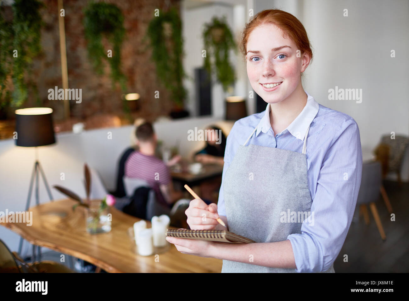 Portrait of Pretty Young Waitress Stock Photo