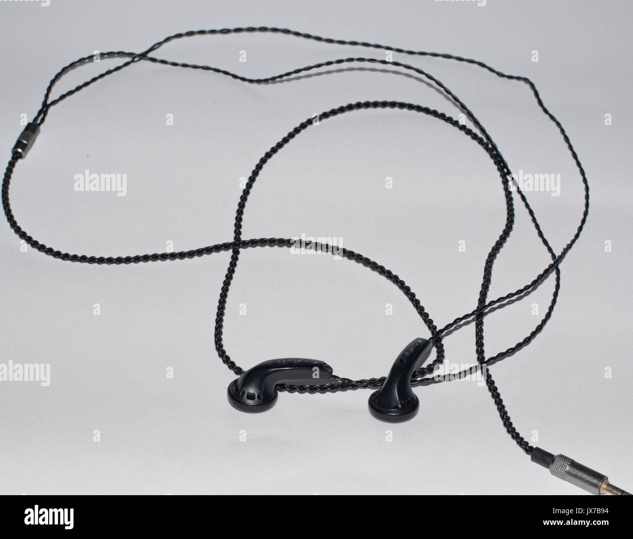 Single thin metal cable loop hanging on sky Stock Photo