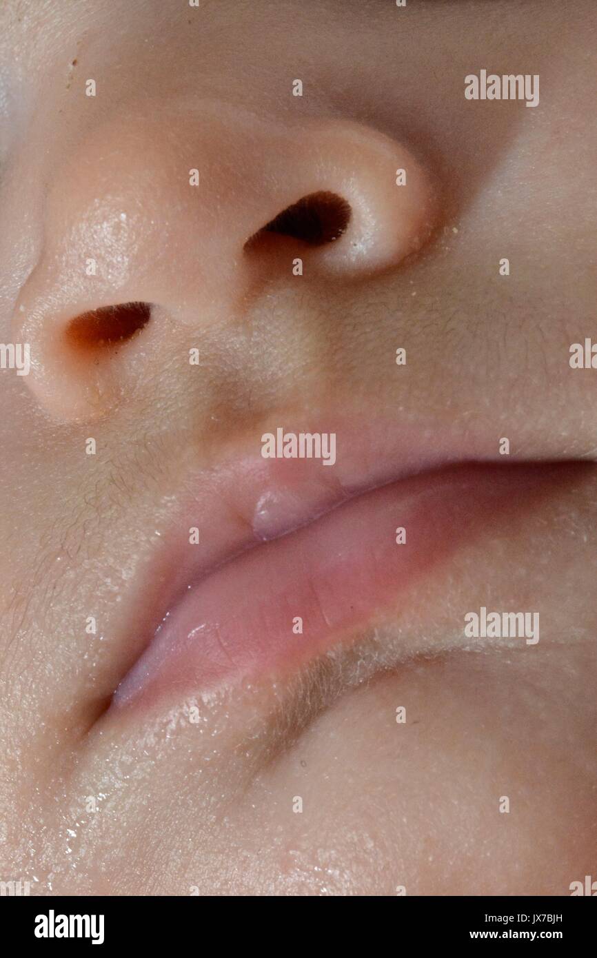 The nose and mouth of a two-month-old baby girl. Stock Photo