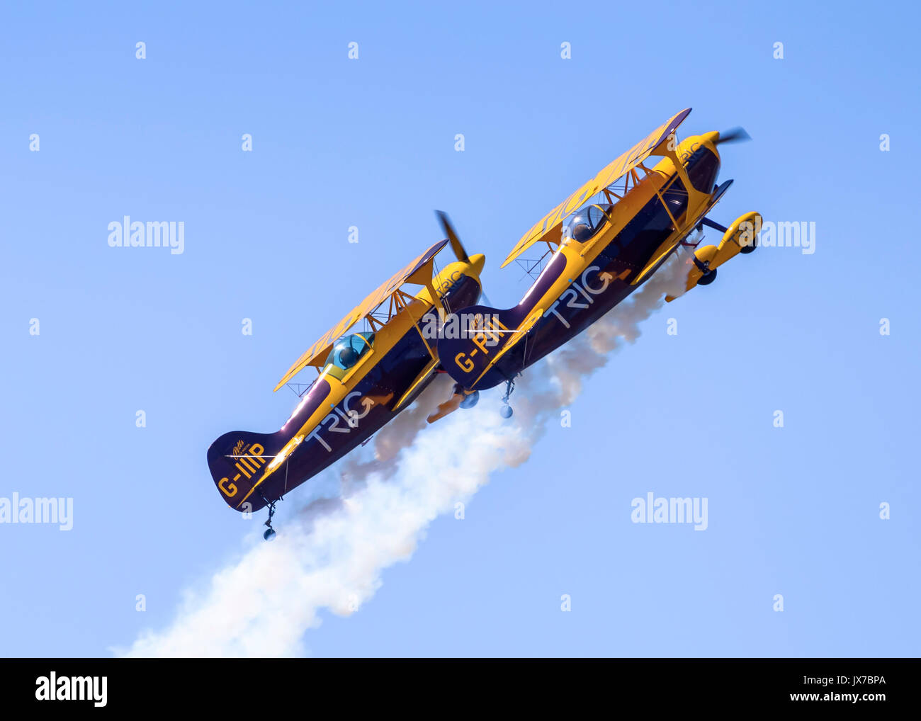 Trig Aerobatic Team performing close-formation aerobatic stunts in their Pitts Special S-1D biplanes Stock Photo