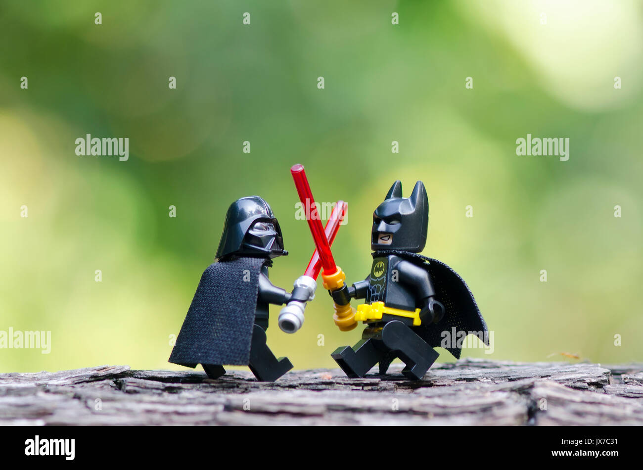 lego darth vader and batman fighting with light saber Stock Photo - Alamy