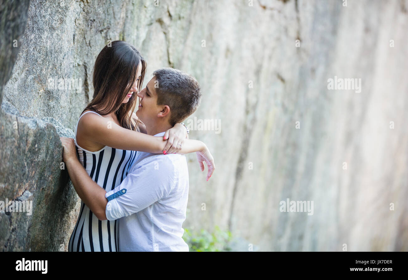 Two young people in love in romantic pose kissing Stock Photo - Alamy