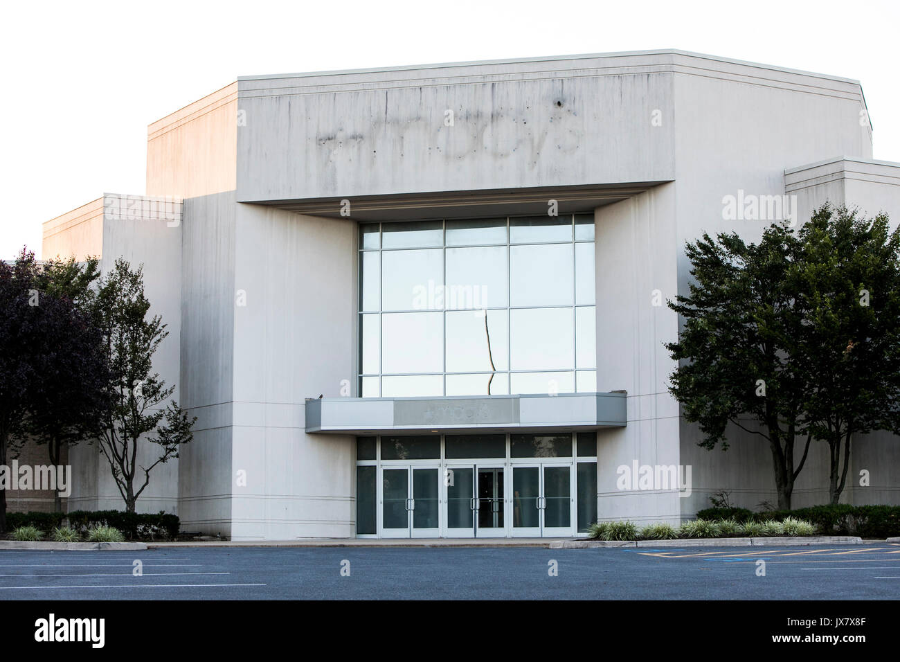 The outline of a Macy's logo sign is seen on the outside of a now