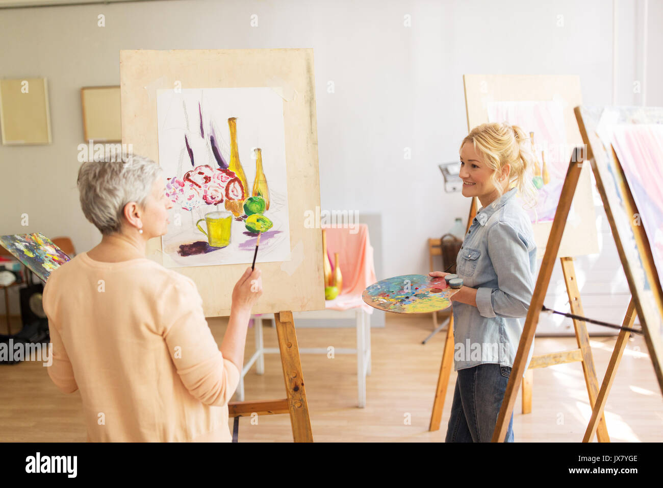 artist women with easels painting at art school Stock Photo Alamy
