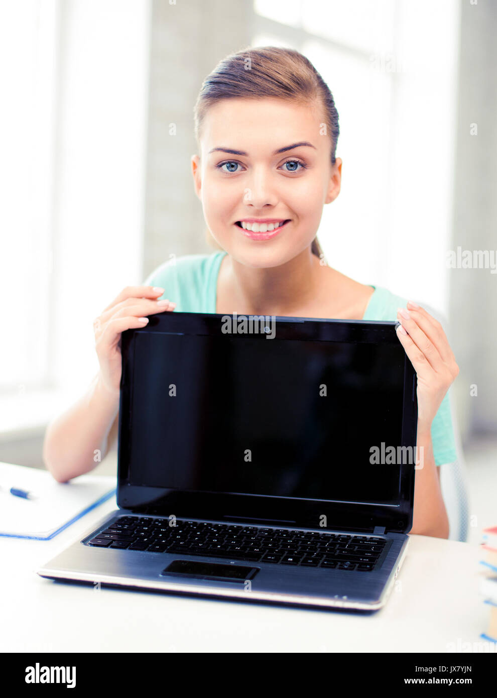 smiling student girl with laptop at school Stock Photo - Alamy