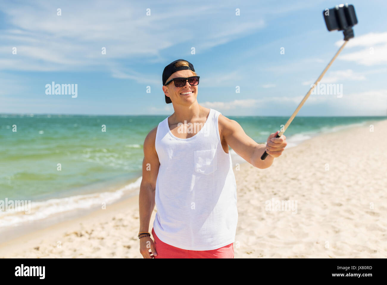 Selfie stick beach hi-res stock photography and images - Alamy