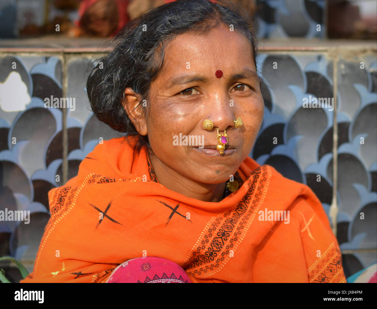 indian adivasi woman with two nose studs and septum nose jewellery JX84PM