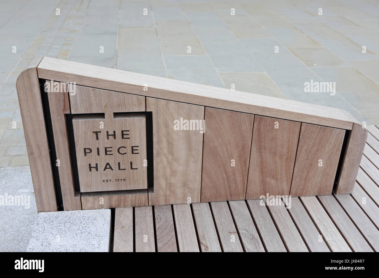 Sign, used as backrest in newly renovated Piece Hall, Halifax, West Yorkshire Stock Photo