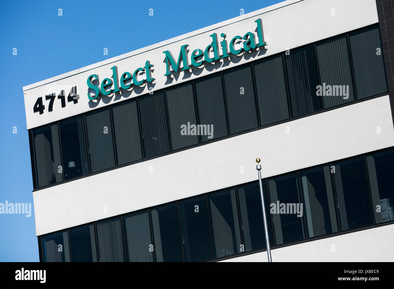 A logo sign outside of the headquarters of Select Medical in Mechanicsburg, Pennsylvania on July