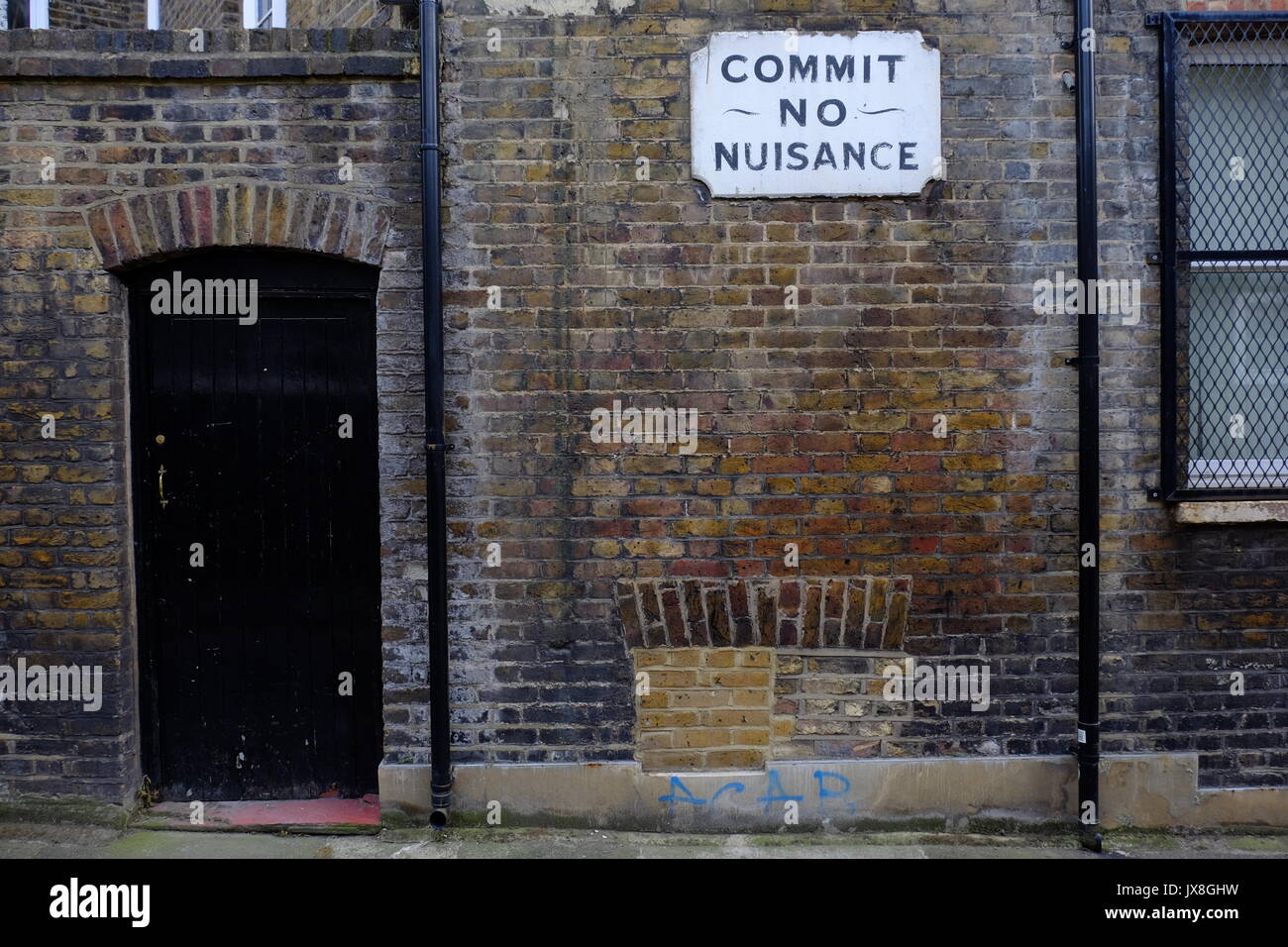 An old Dickensian Commit No Nuisance sign in Southwark, London Stock Photo