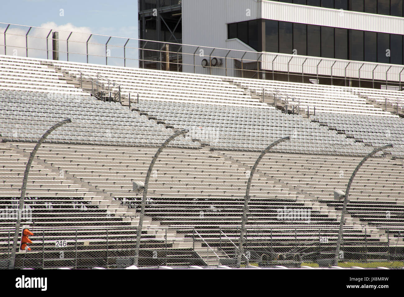 Empty seats in stands of modern motor speedway. Stock Photo