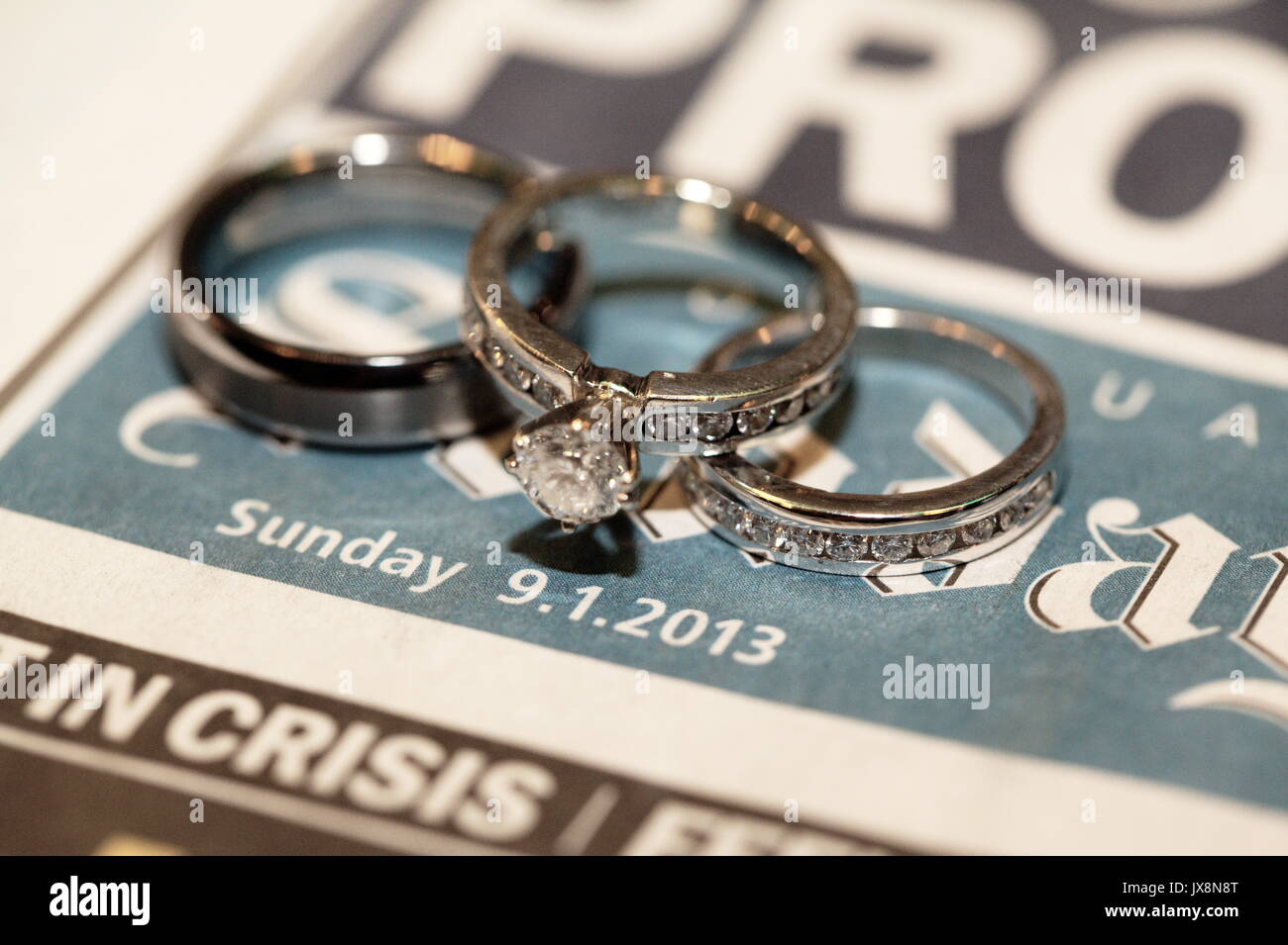 Wedding rings on news paper day of wedding Stock Photo Alamy