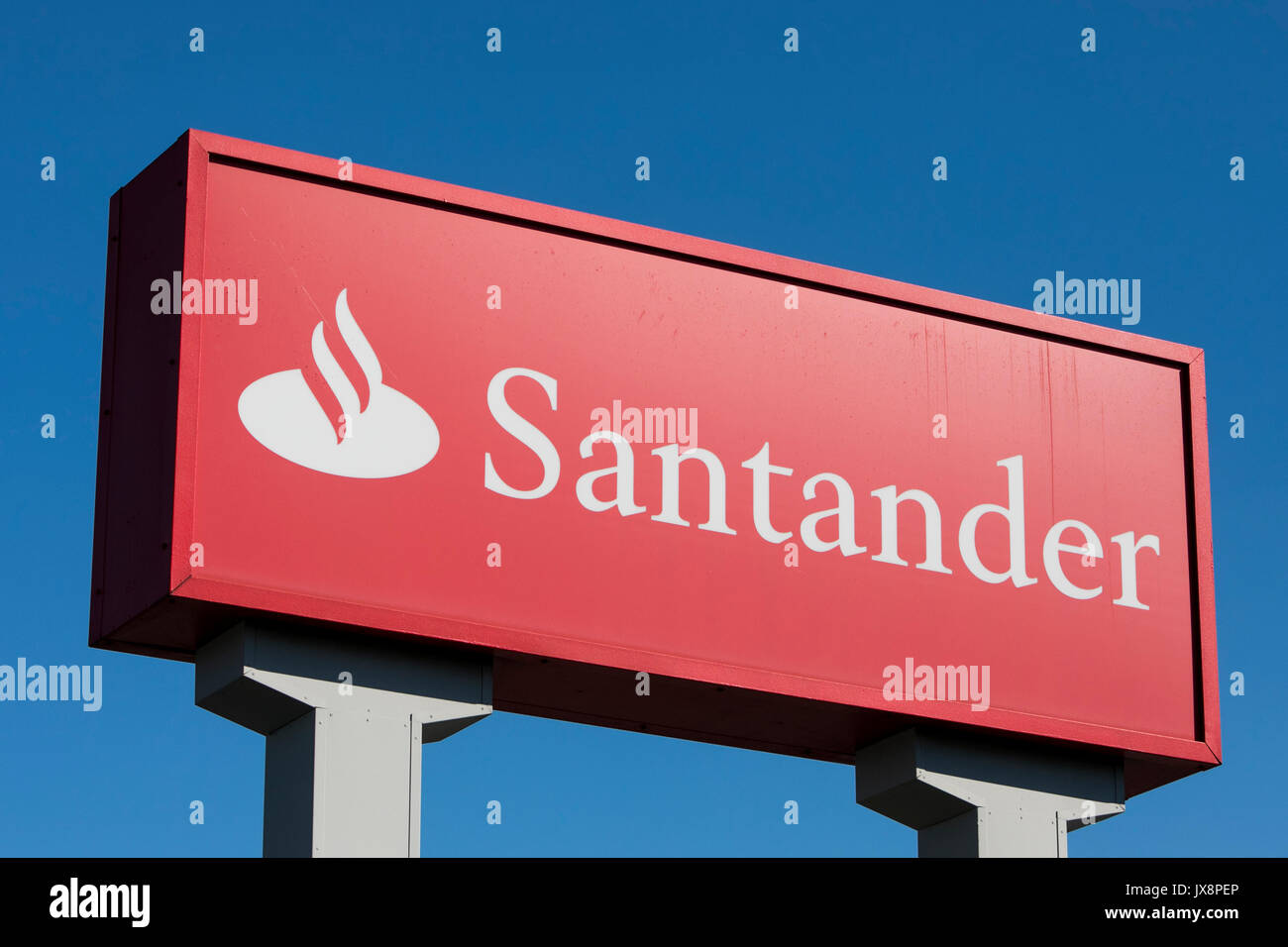 A logo sign outside of a Santander Bank branch in Camp Hill