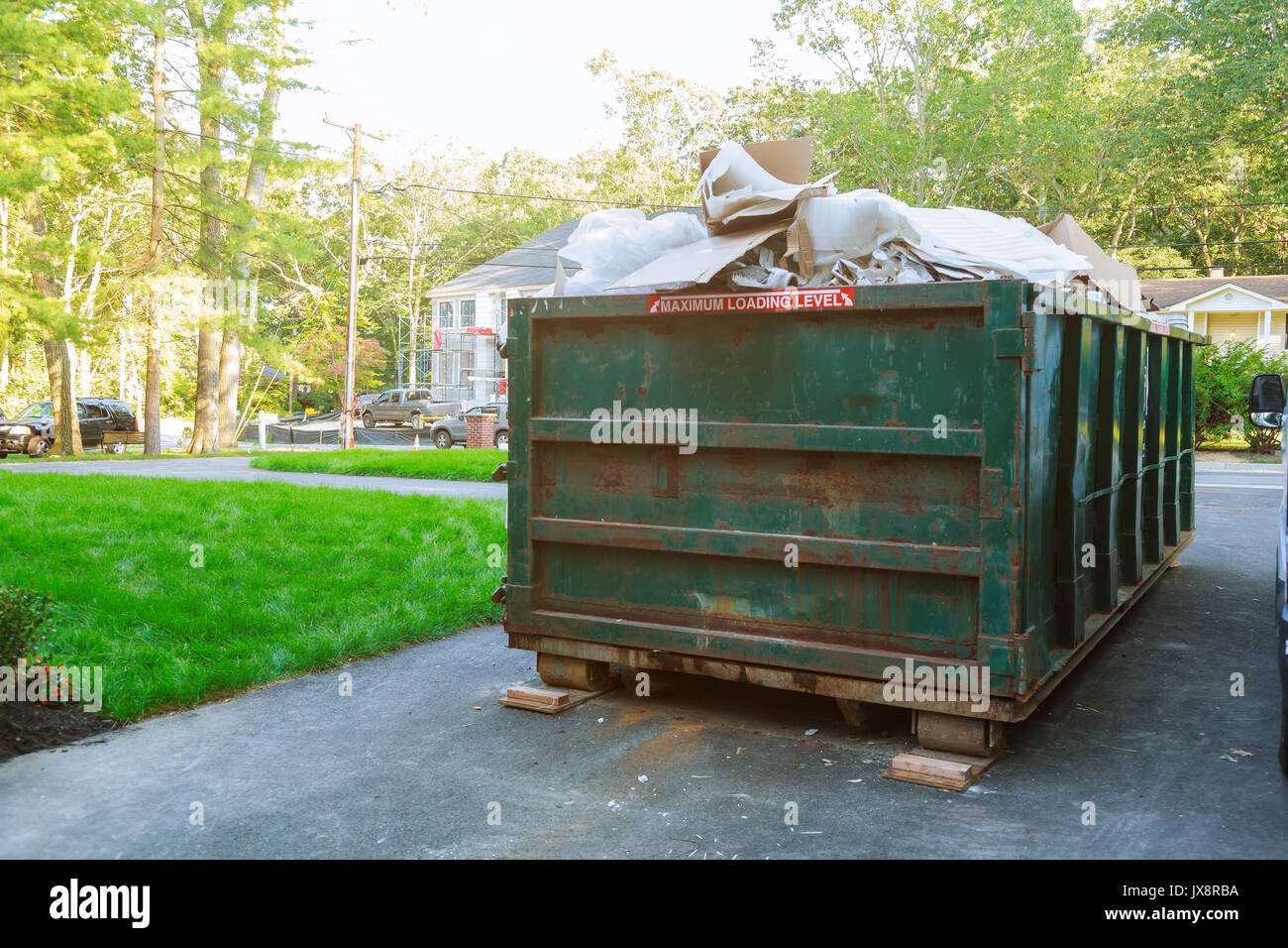 Dumpsters being full with garbage container Over flowing Stock Photo