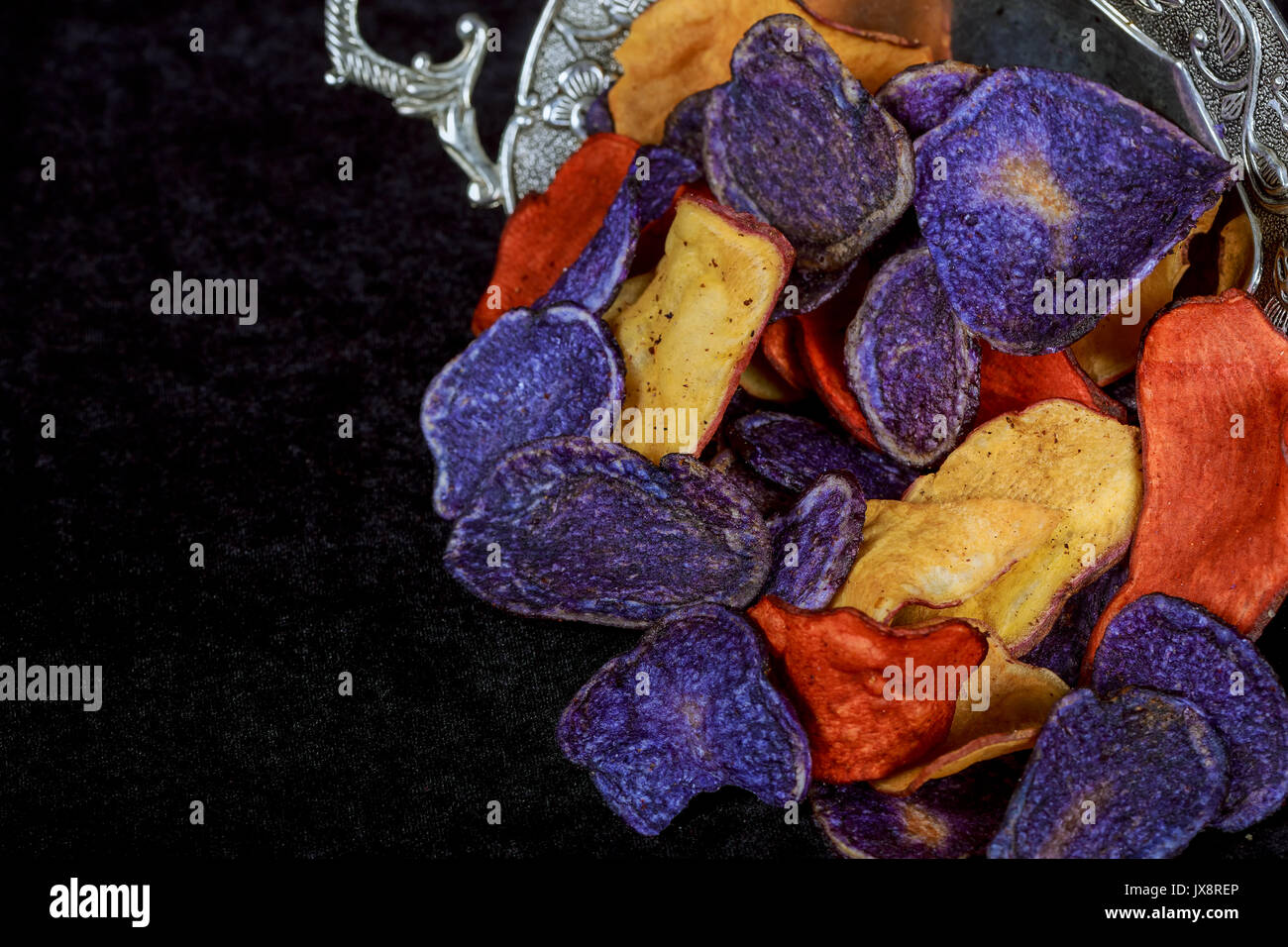 Potato red blue chips Beet and carrot salty chips in the bag from the