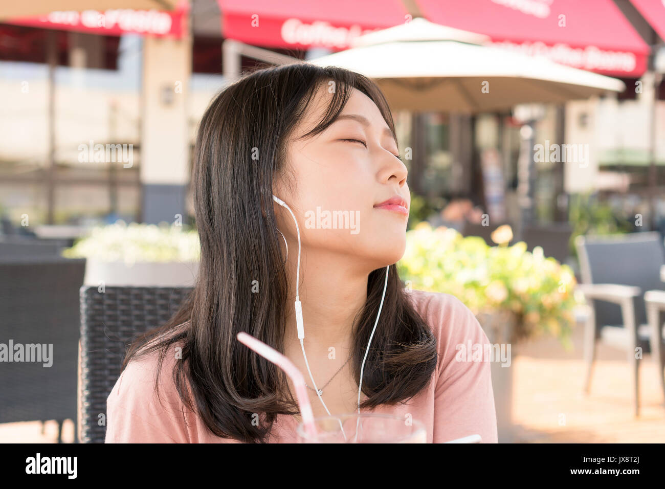 Chinese girl listening music Stock Photo