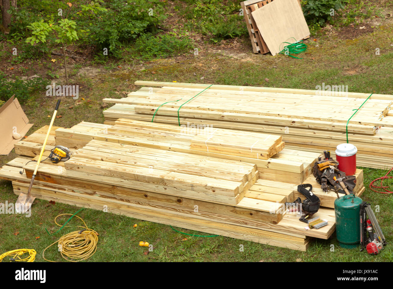 lumber being used in construction of a deck Stock Photo Alamy