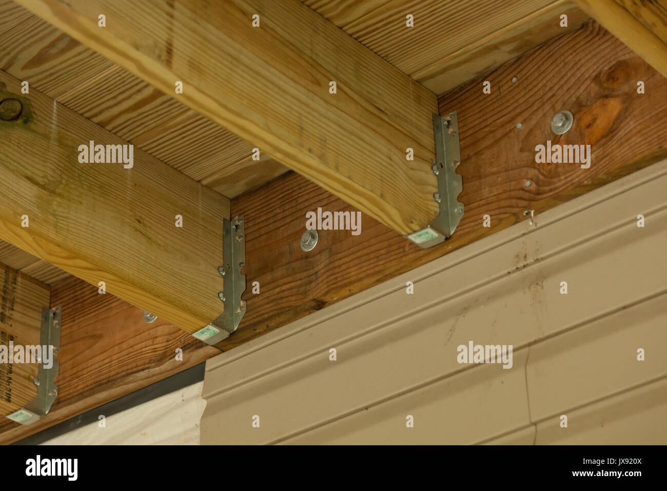 Lumber framing on a new deck with metal support Stock Photo Alamy