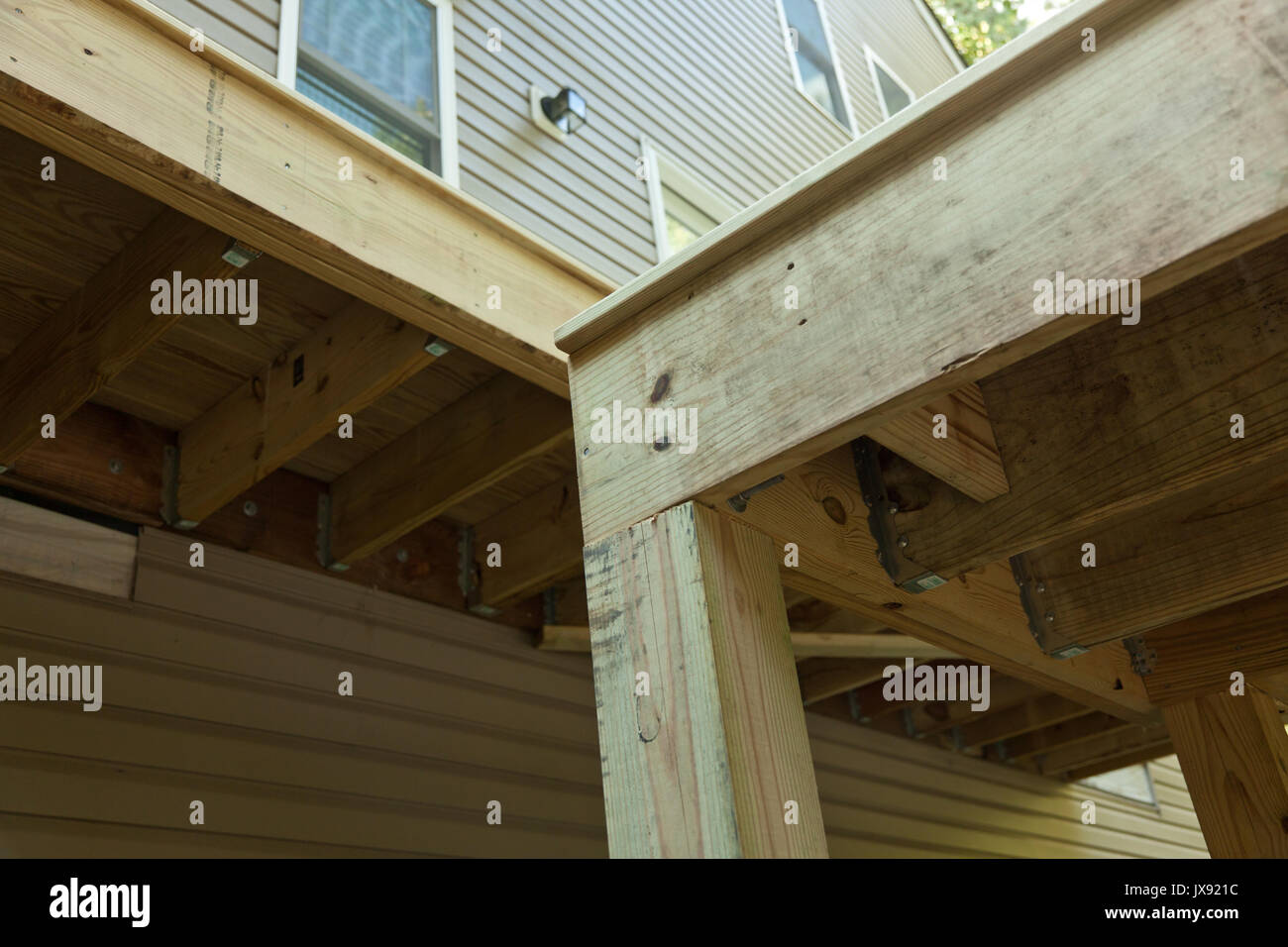 Lumber framing on a new deck with metal support Stock Photo Alamy
