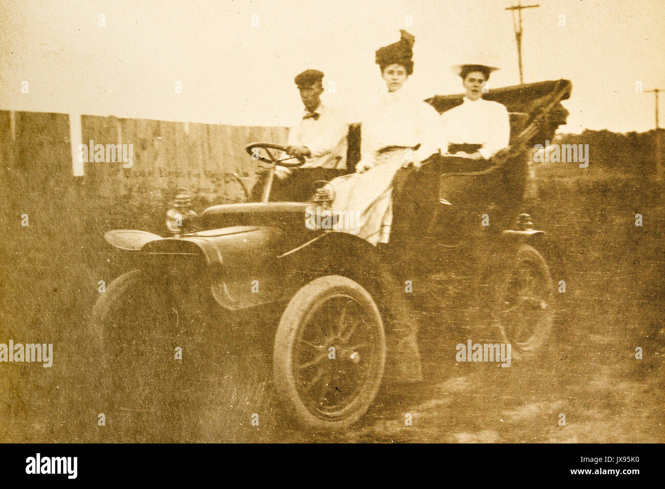 Women and man having fun in a 1907 Cadillac touring car automobile. Minnesota 1907 1908 Stock Photo