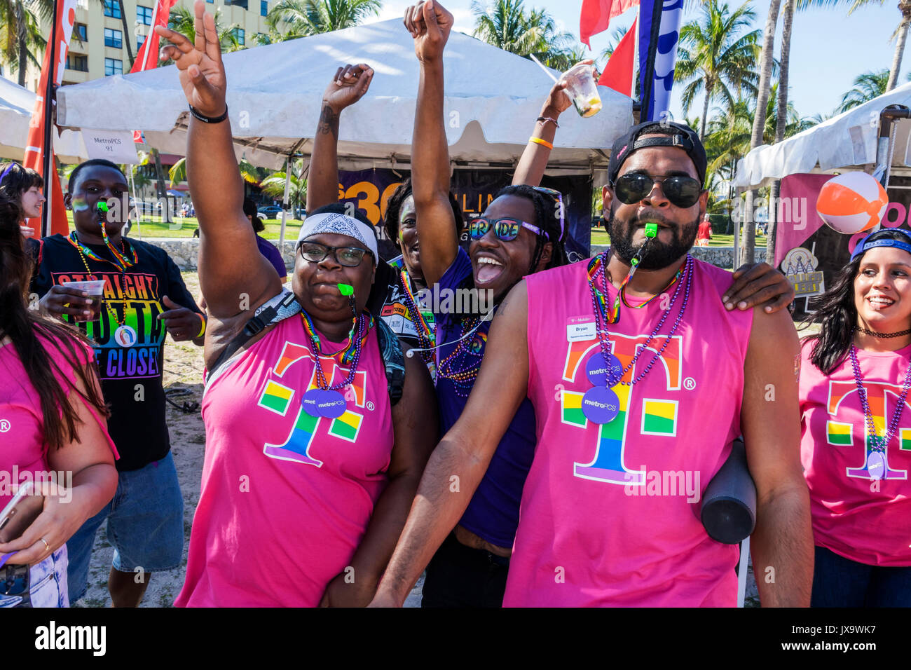 Miami Beach Florida,Lummus Park,Gay Pride Week,LGBTQ,LGBT,Miami Beach,Pride Festival,Black man men male,woman female women,dancing,MetroPCS,corporate Stock Photo