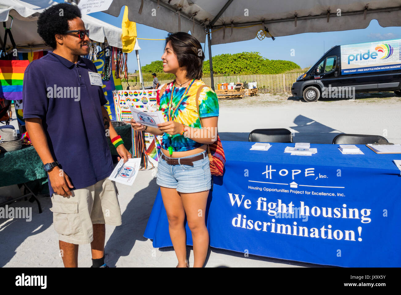 Miami Beach Florida,Lummus Park,Gay Pride Week,LGBTQ,LGBT,Miami Beach,Pride Festival,information booth,housing discrimination,HOPE,FL170430015 Stock Photo