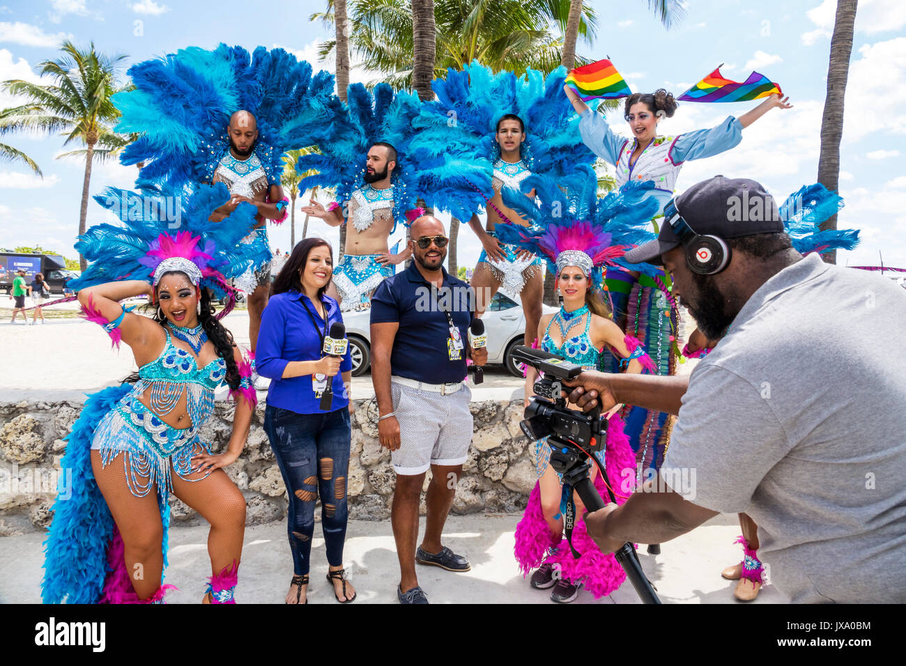 Miami Beach Florida,Lummus Park,Gay Pride Week,LGBTQ,LGBT,Pride Parade,participants,staging area,Hispanic media,tv television,reporter,microphone,FL17 Stock Photo