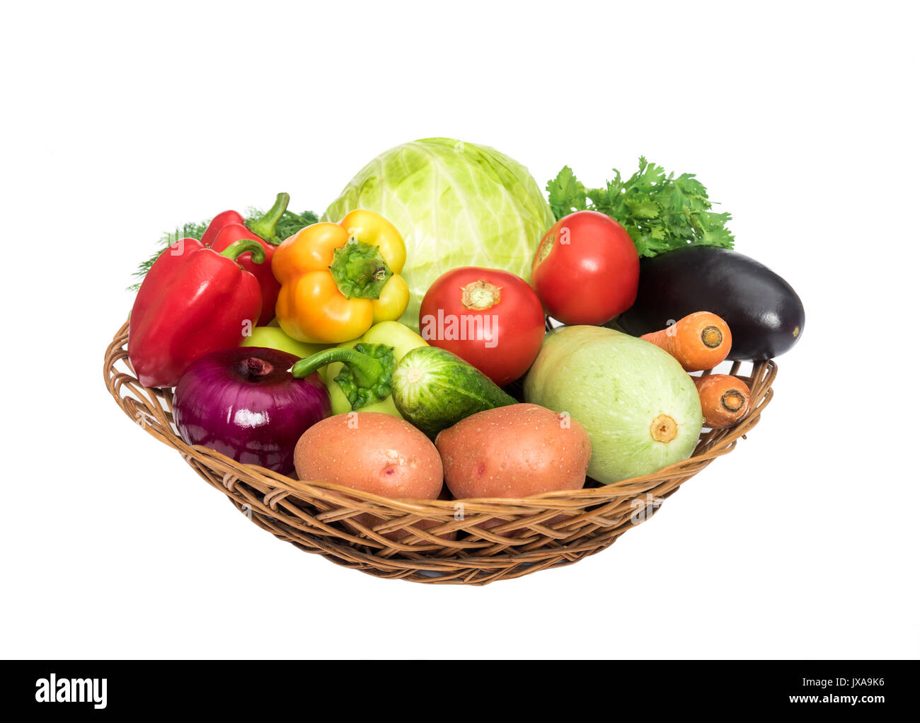 Basket with fresh mixed vegetables on white background Stock Photo