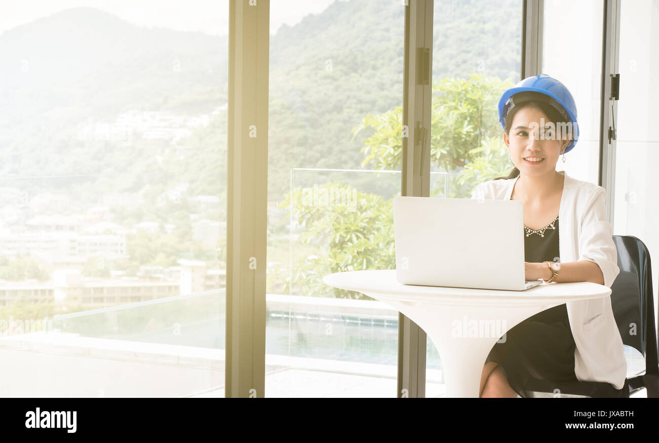 Female engineers are using a computer, system analysis and design. in