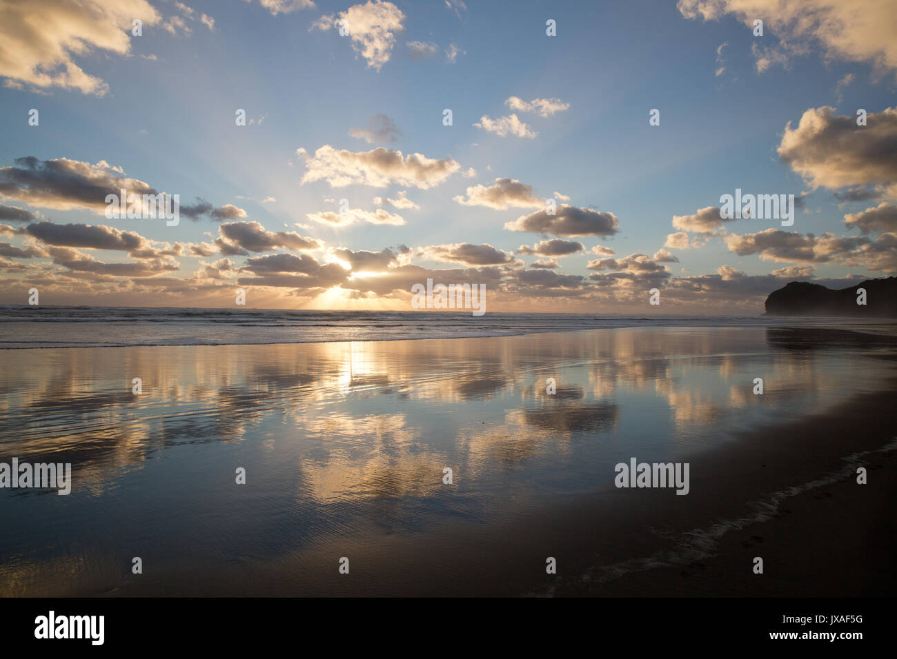 Sunset on Piha Beach New Zealand Stock Photo