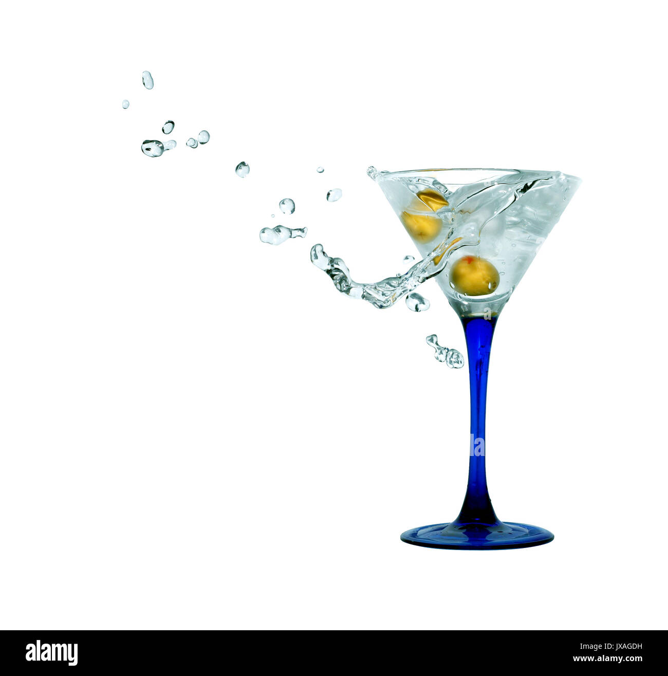 Nice martini glass with splashing beverage and green olive. Isolated on white with clipping path Stock Photo