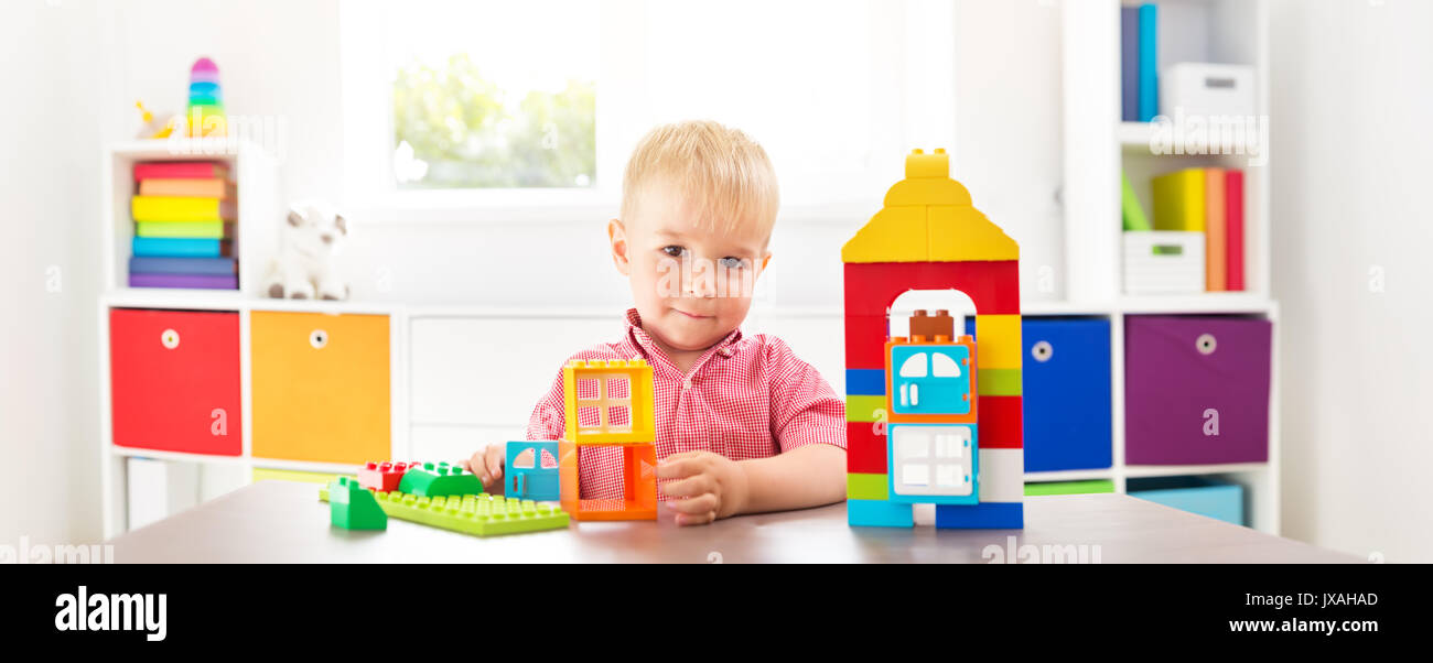 Little child playing with blocks Stock Photo - Alamy