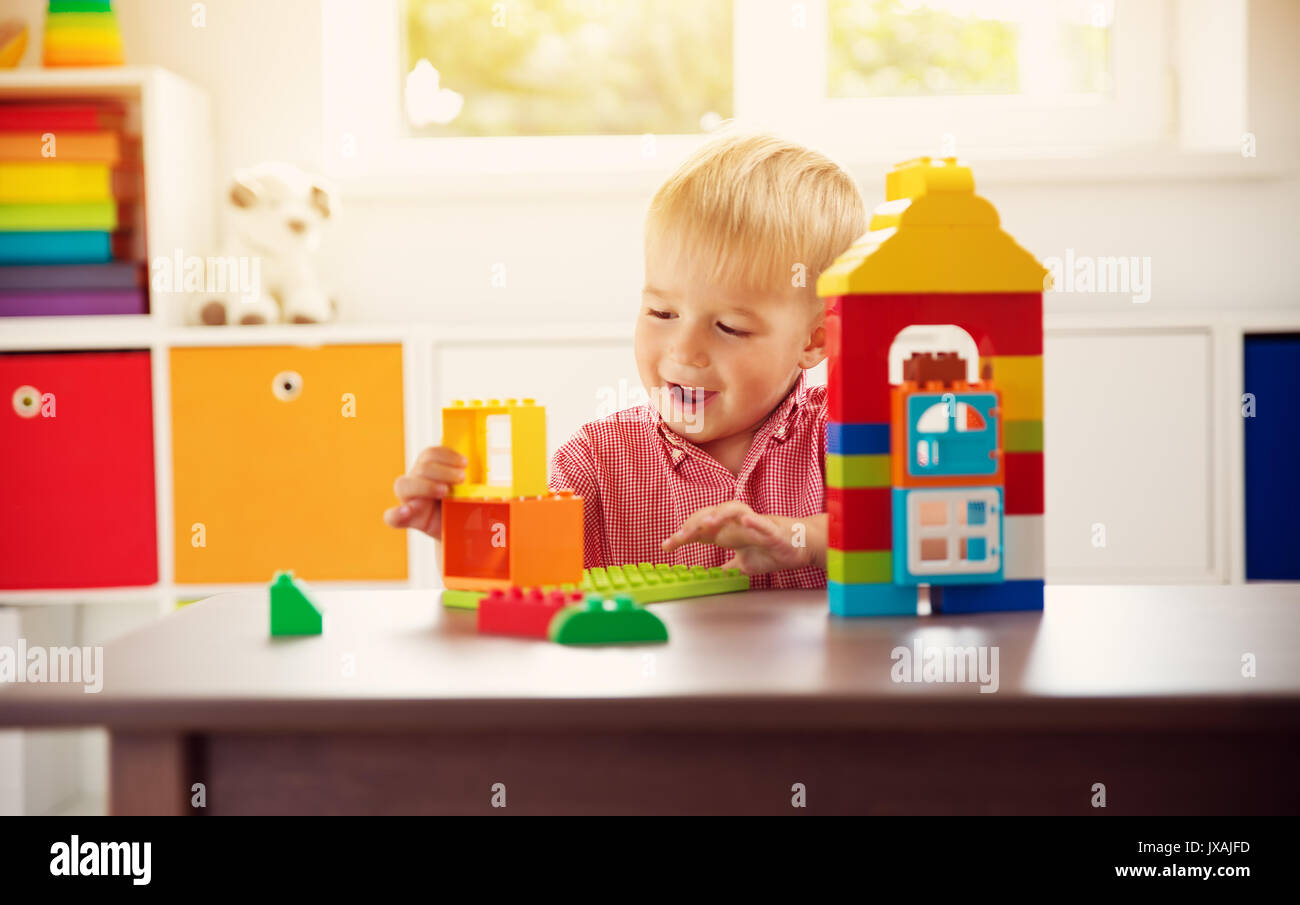 Little child playing with blocks Stock Photo - Alamy