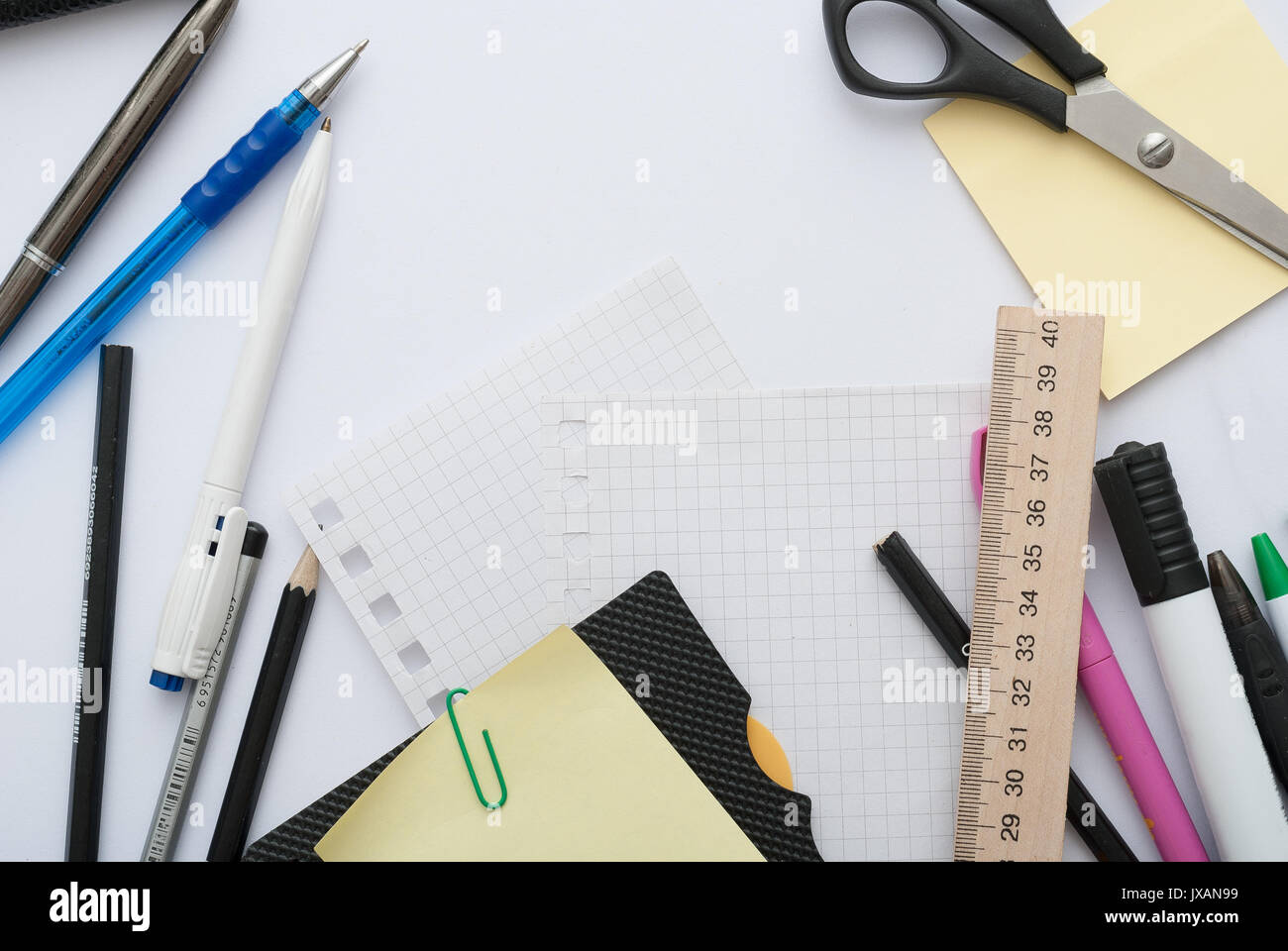 School set with back to school inscription in notebook and stationery on wooden background Stock Photo