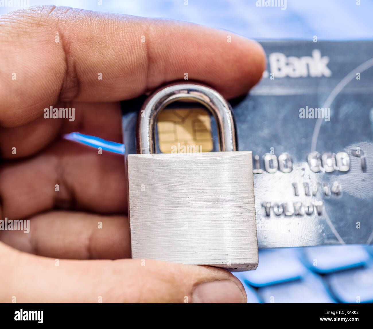 Credit cards and simle mechanical lock. Security concept. Stock Photo