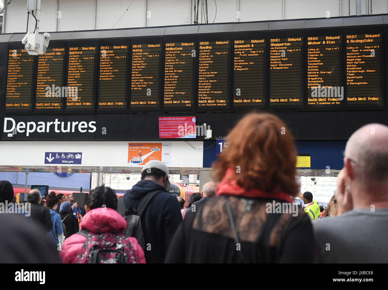 The departures board at Waterloo Station, London, showing delays after a South West Trains
