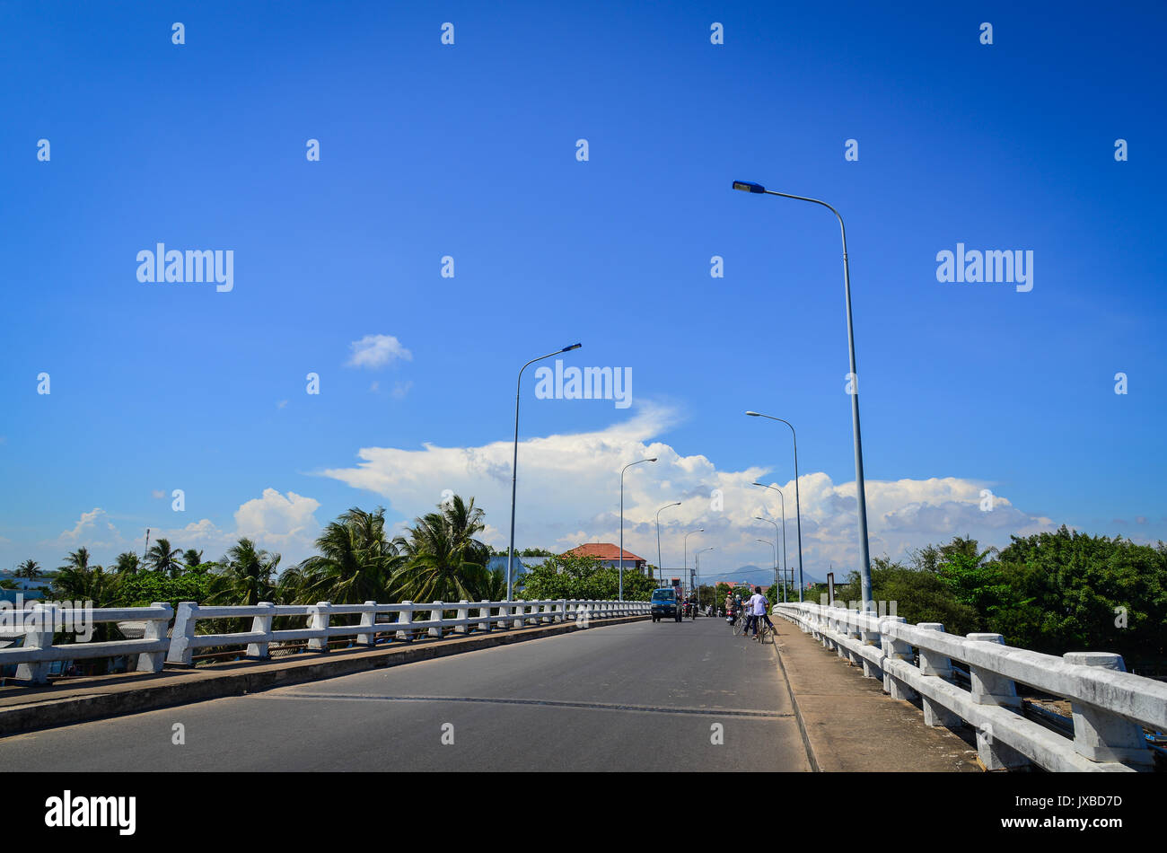Traffic on the bridge in Phan Thiet, Vietnam. Phan Thiet is the capital of Binh Thuan Province and is surrounded by pristine beaches such as Mui Ne, K Stock Photo
