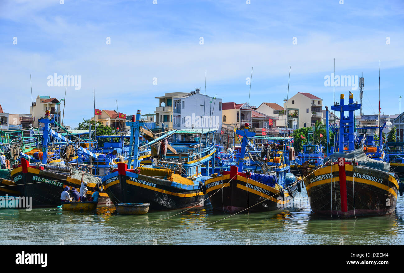 Phan Thiet, Vietnam - Mar 26, 2017. Fishing boats docking at pier in ...