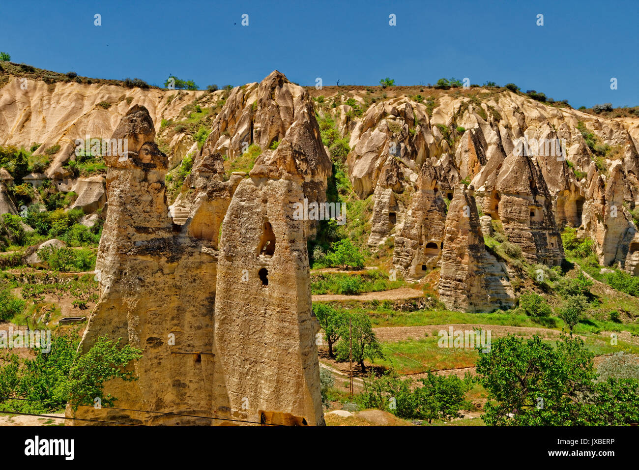 Cave dwellings and fairy chimneys at Goreme National Park, Cappadocia, Turkey Stock Photo