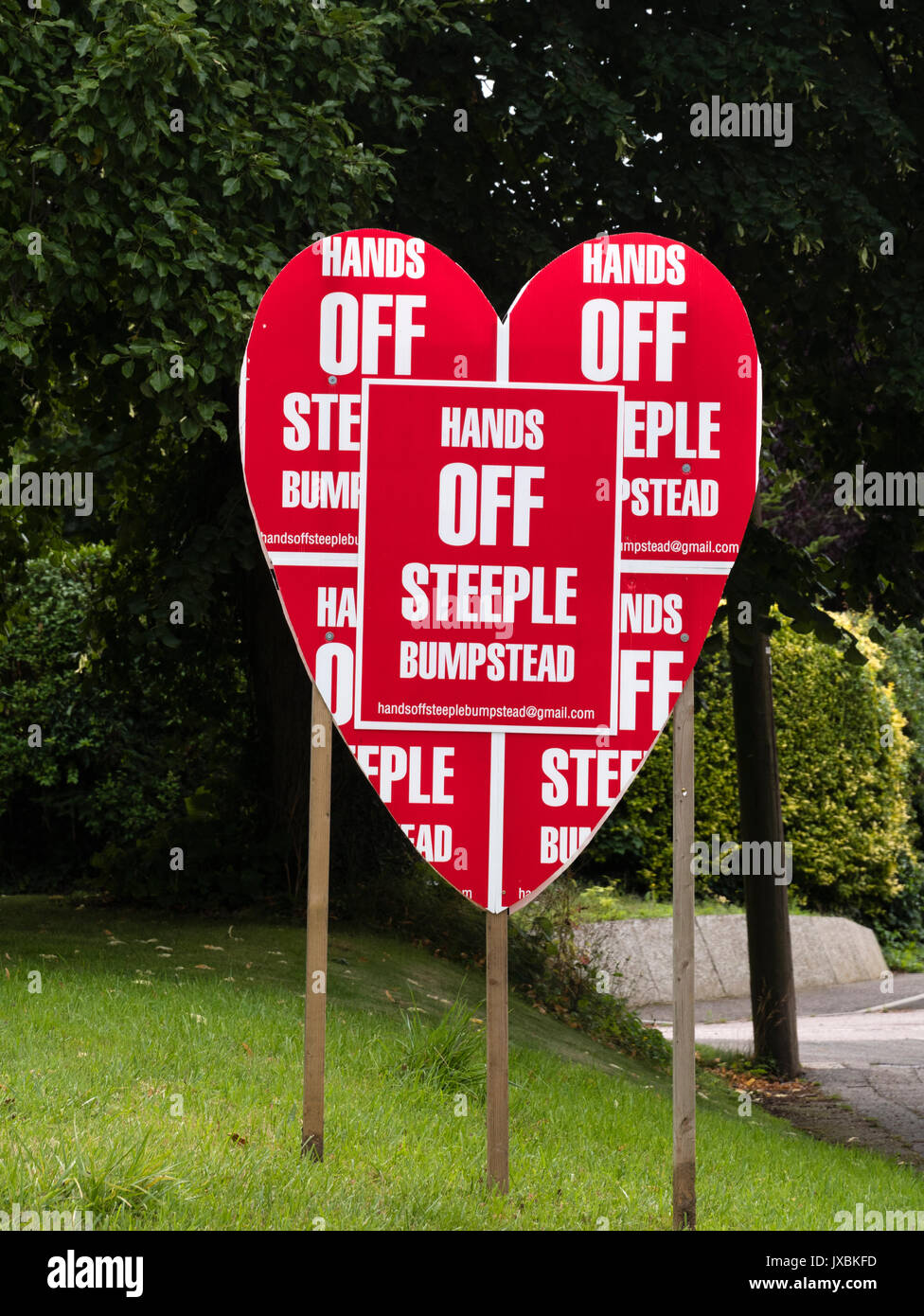 A sign promoting the 'Hands off Steeple Bumpstead campaign.  This campaign opposes inappropriate housing development in Steeple Bumpstead Stock Photo