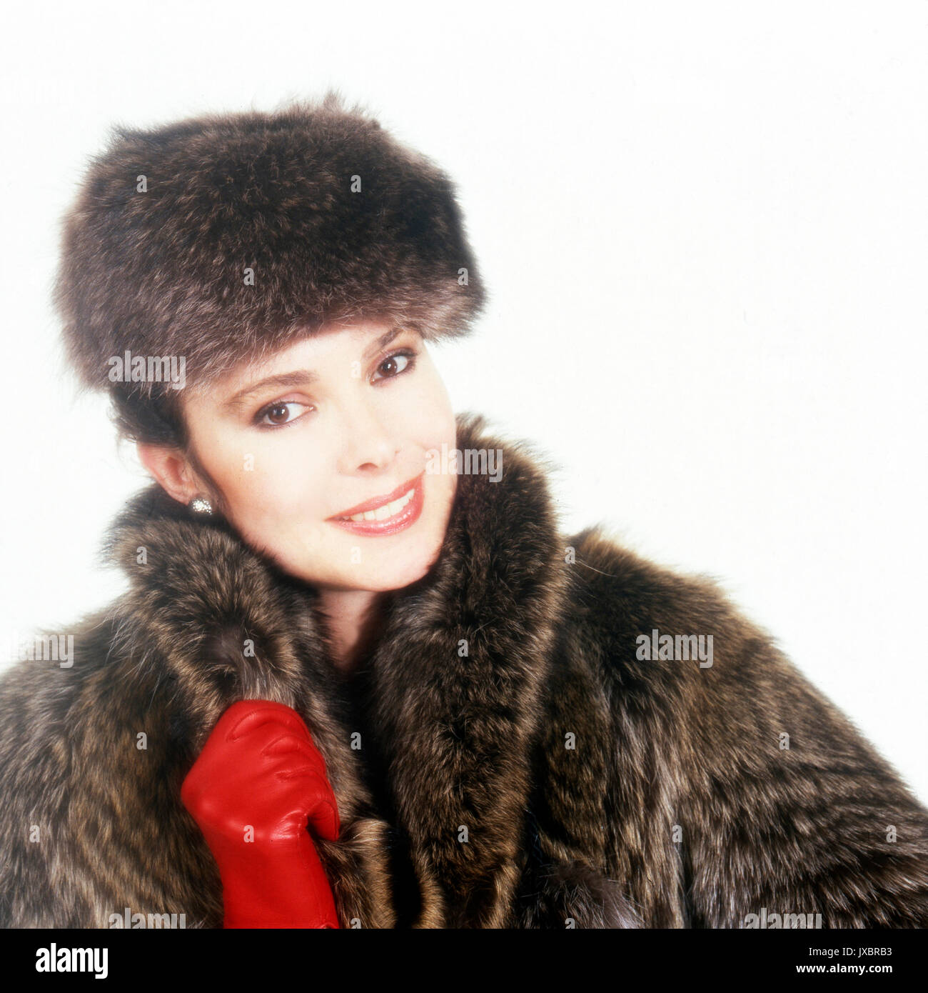 Frau mit Pelzmantel, 1980er. Woman with fur coat, 1980s. Stock Photo