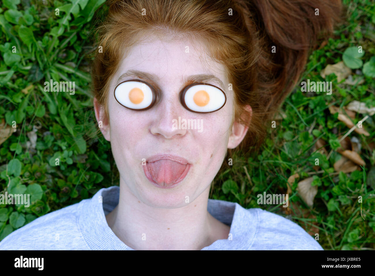 Girl, funny portrait, Easter eggs on the eyes, Easter, Upper Bavaria, Bavaria, Germany Stock Photo