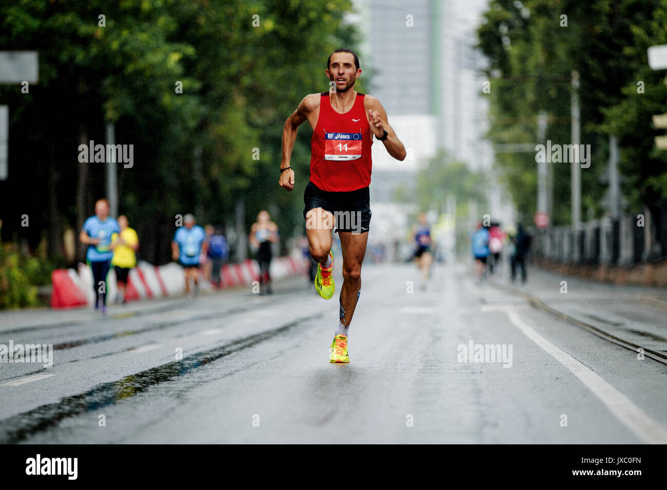 runner winner of marathon running street in rain during Europe-Asia Marathon  Stock Photo - Alamy