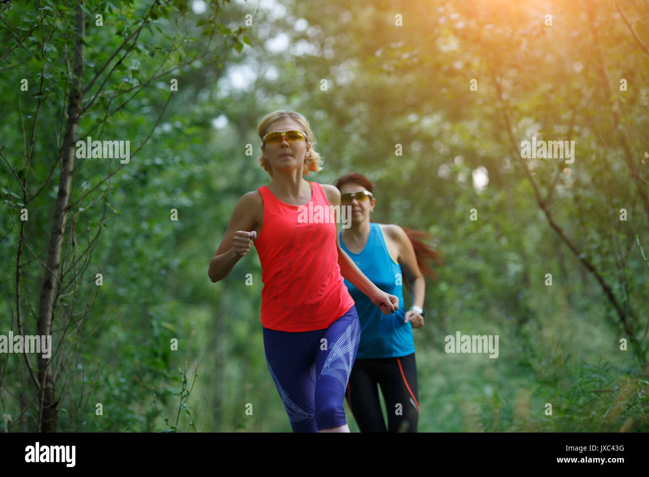 Two joyful women in sportswear hi-res stock photography and images - Alamy