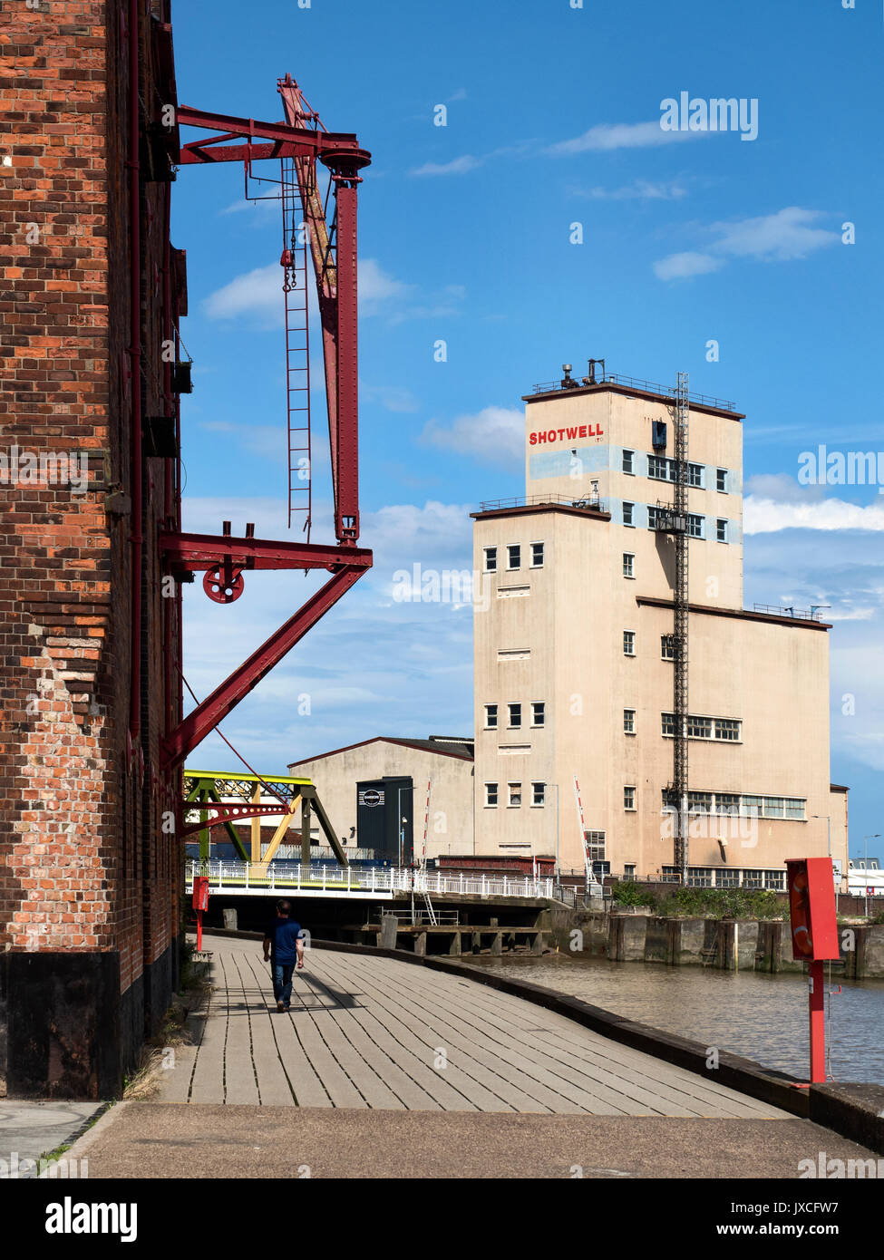 Old Hoist along the Riverside Walk  by the River Hull and Shotwell Tower Hull Yorkshire England Stock Photo