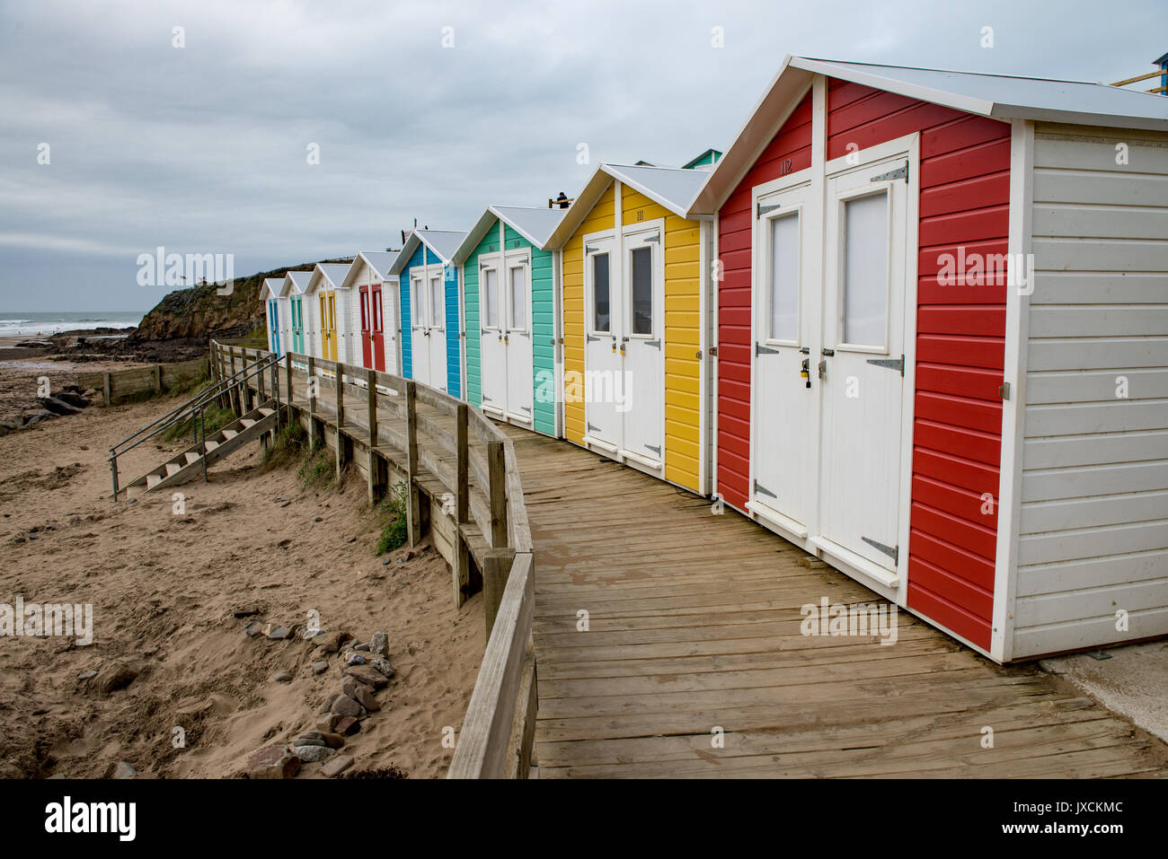Colourful modern beach huts built to a traditional style at Bude beach