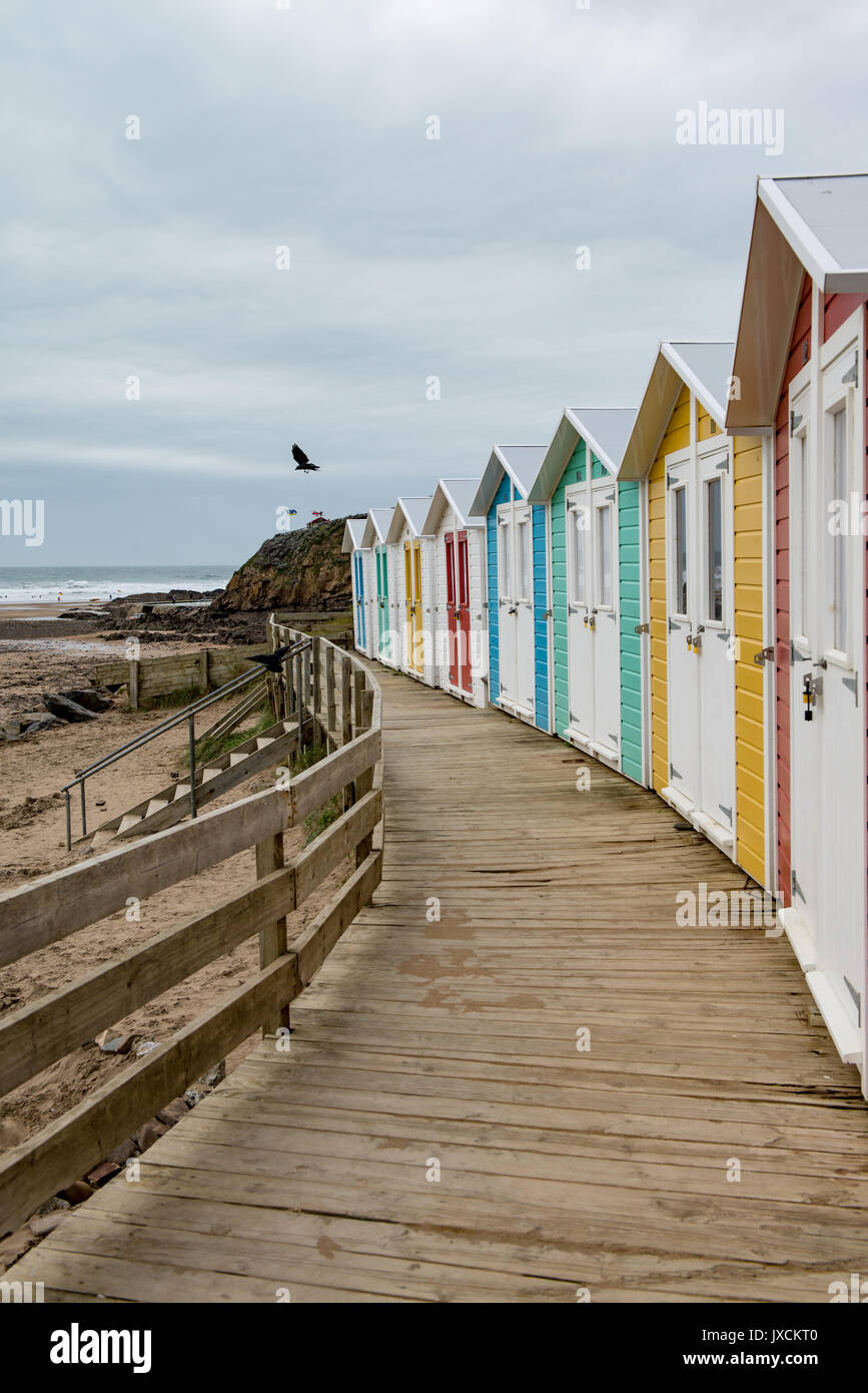 Colourful modern beach huts built to a traditional style at Bude beach